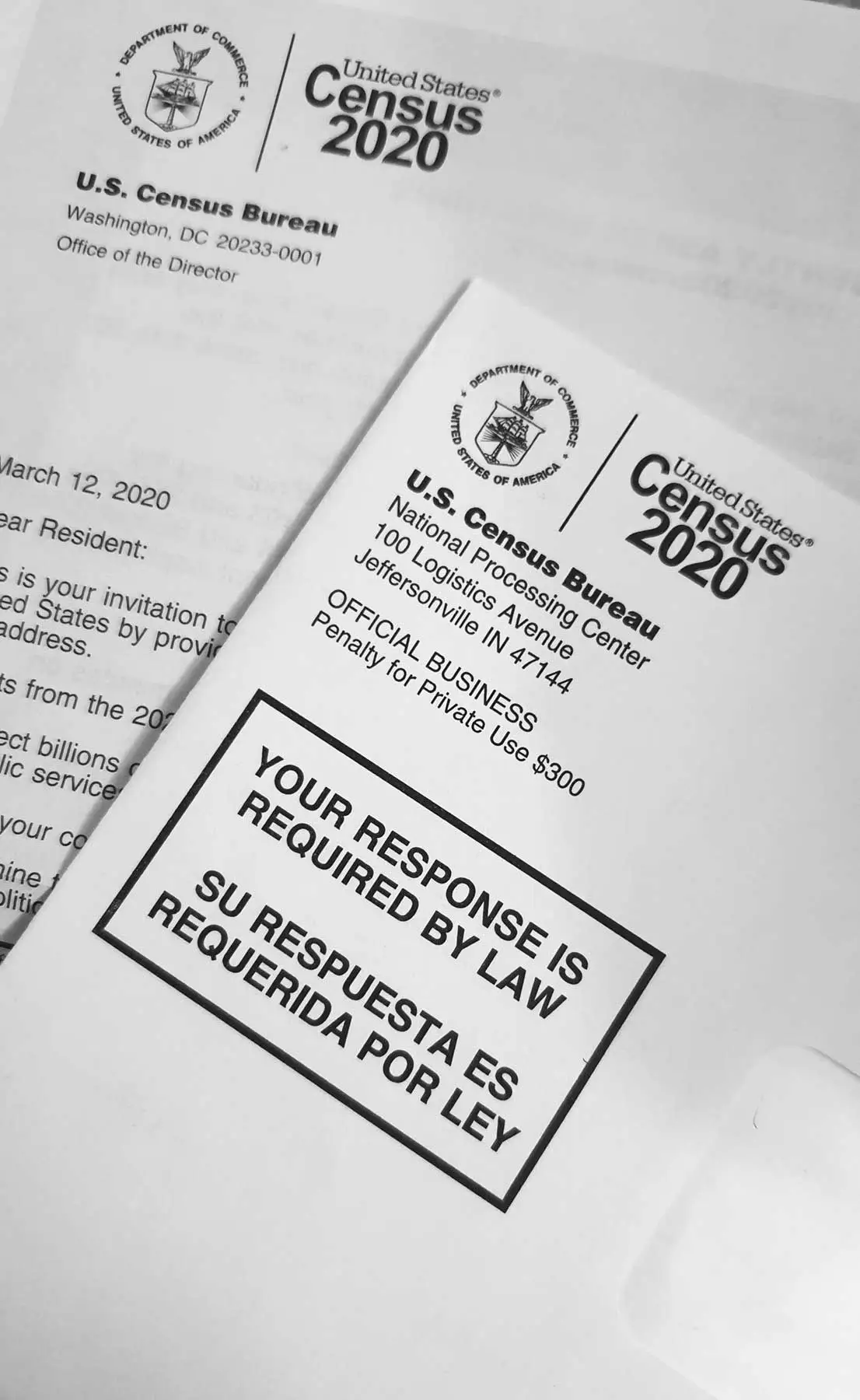 Census bureau documents strewn across a desk.