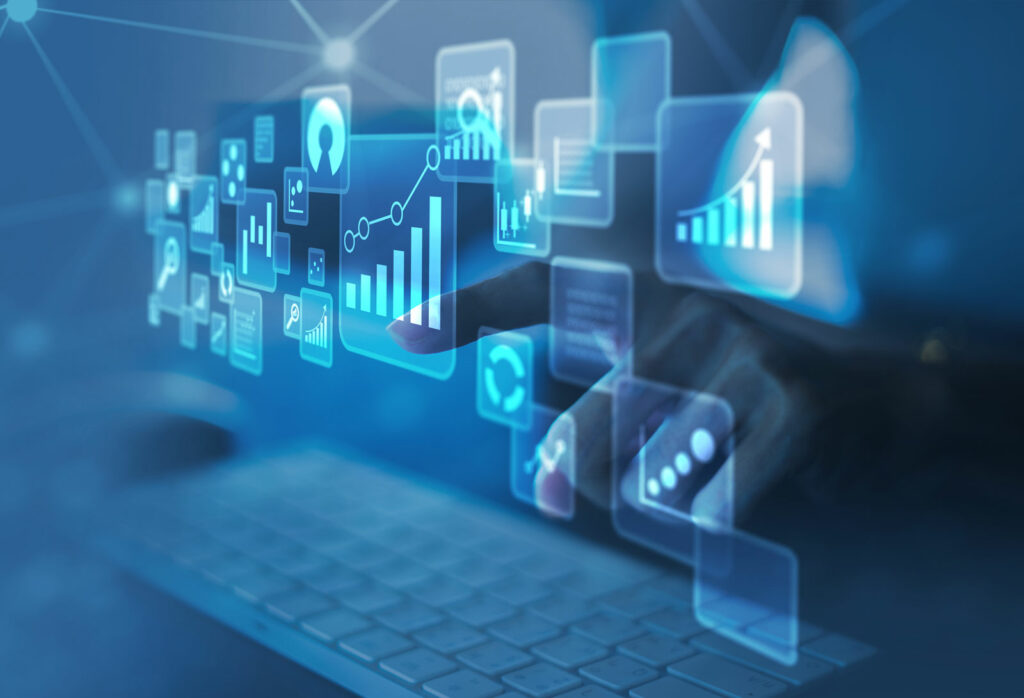 A digital concept image showing a person's hand interacting with floating icons that represent data and analytics, such as graphs, charts, and magnifying glass symbols, over a blurry keyboard in the background. The scene is set against a blue, futuristic interface.